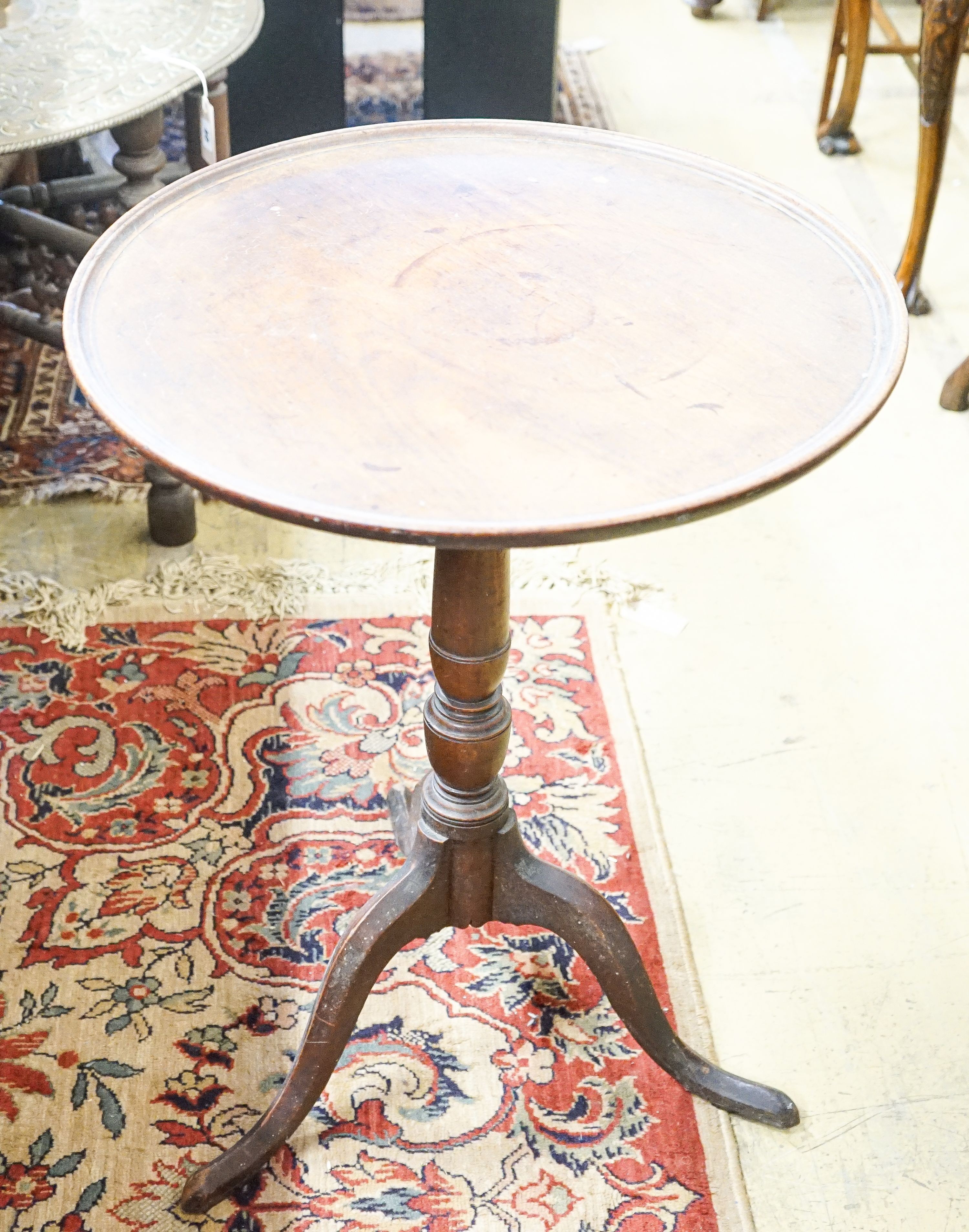 A George III mahogany tilt top tripod table, diameter 53cm, height 71cm